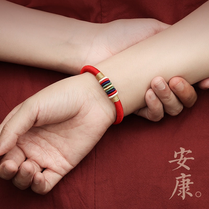 The Ninefold Kashaya Red String Bracelet