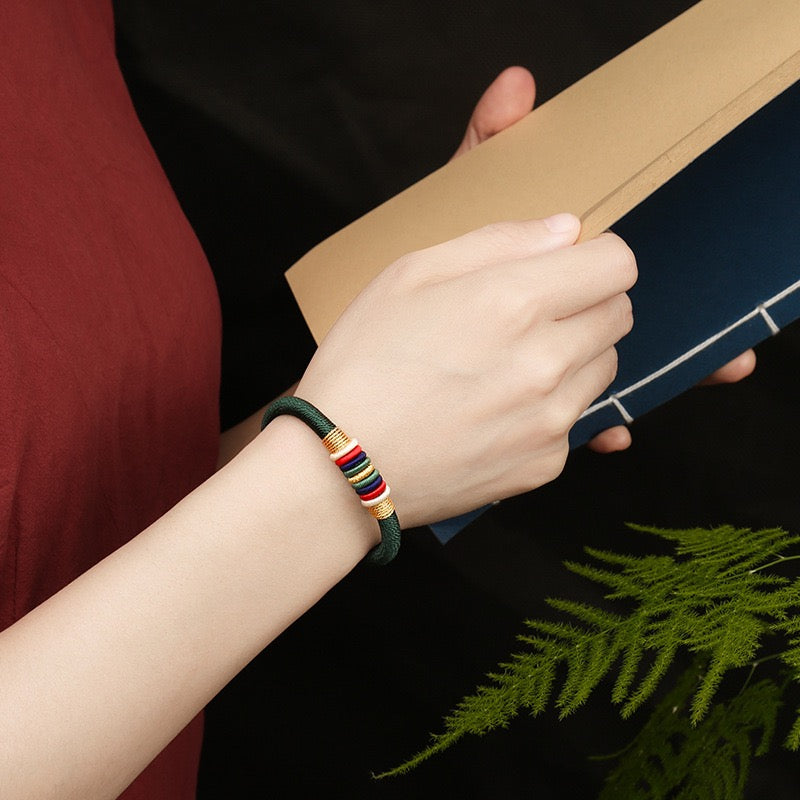 The Ninefold Kashaya Red String Bracelet